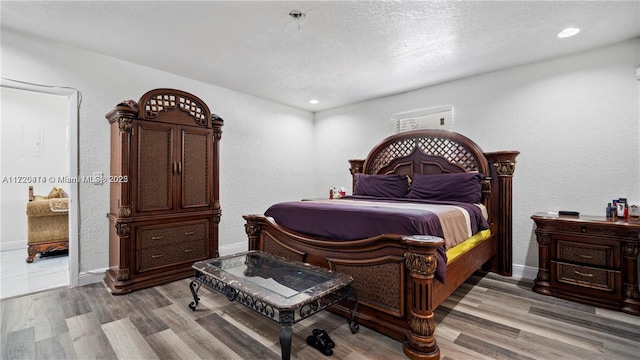 bedroom with light hardwood / wood-style flooring