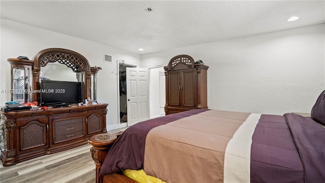 bedroom with light wood-type flooring