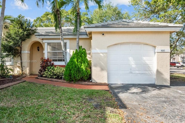 single story home with a garage