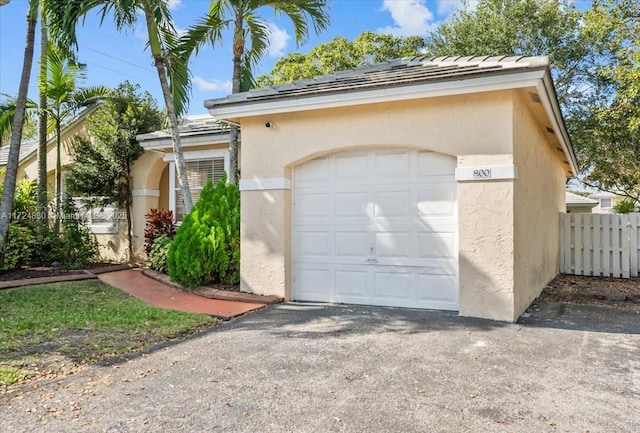 garage featuring fence