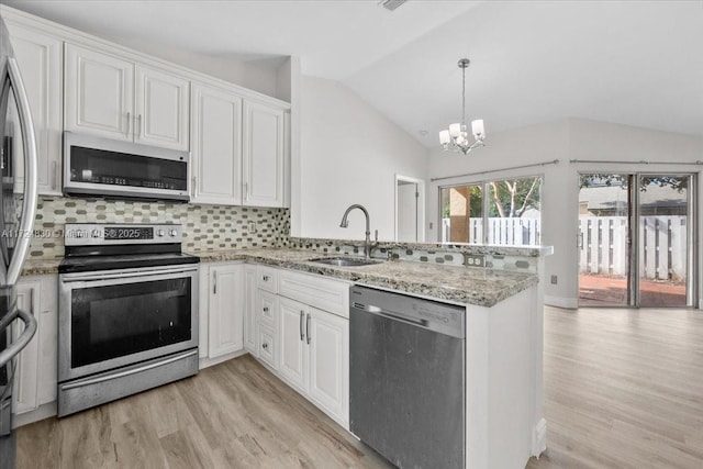 kitchen featuring white cabinets, appliances with stainless steel finishes, and sink