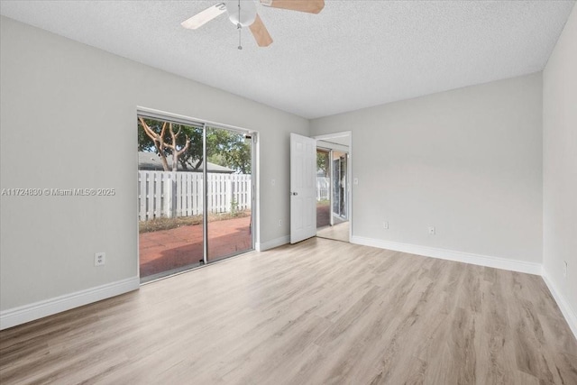 spare room featuring a textured ceiling, light hardwood / wood-style floors, and ceiling fan