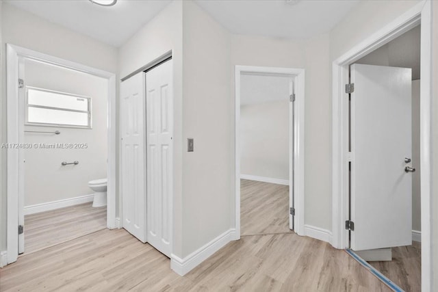 hallway featuring light hardwood / wood-style flooring