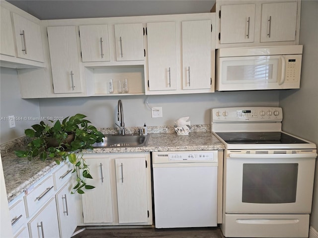 kitchen featuring sink and white appliances