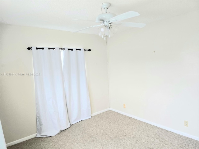 empty room with ceiling fan and carpet floors