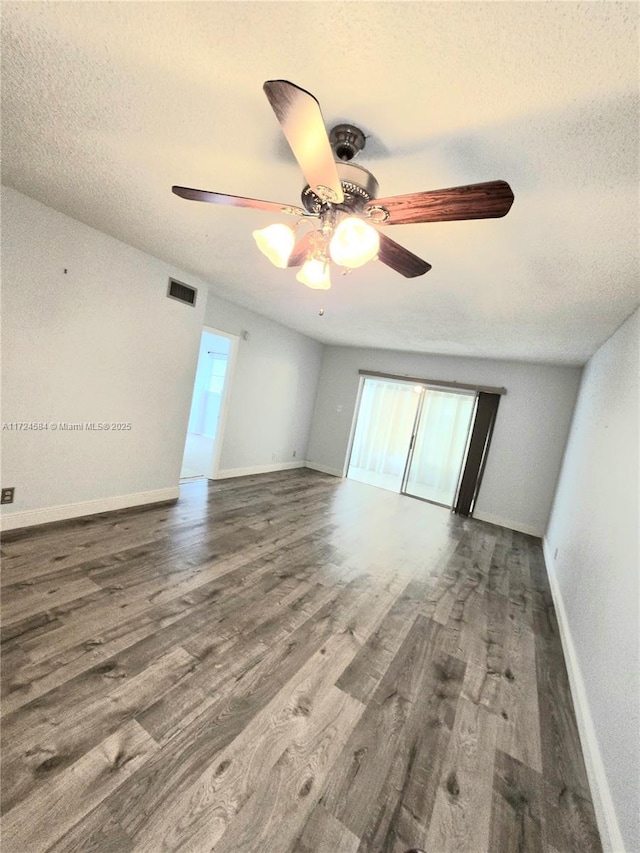 spare room featuring hardwood / wood-style floors, a textured ceiling, and ceiling fan