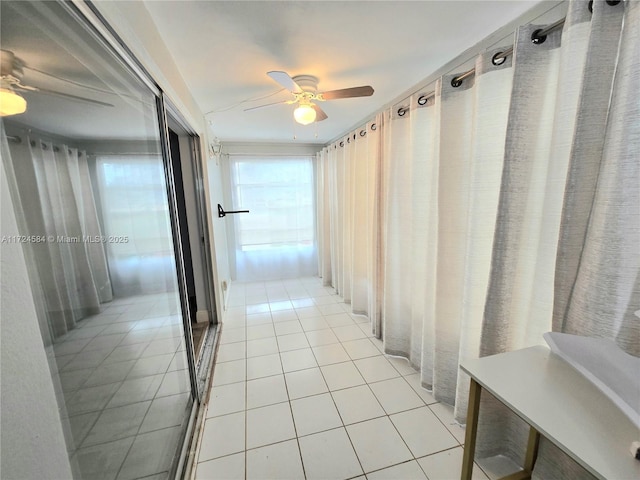 corridor featuring light tile patterned flooring