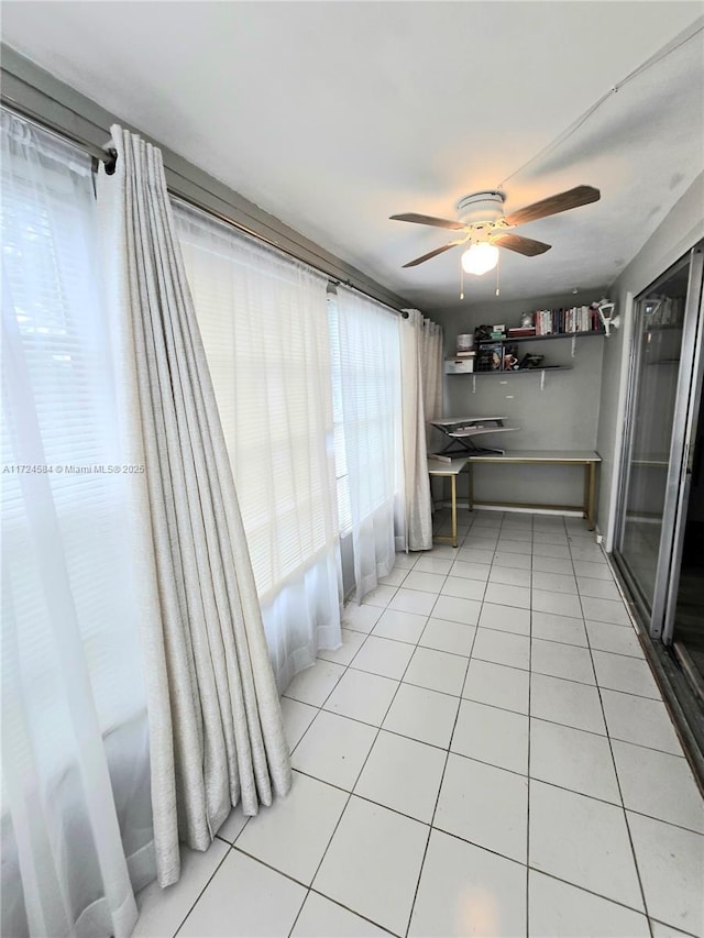 unfurnished room featuring carpet, a textured ceiling, and ceiling fan