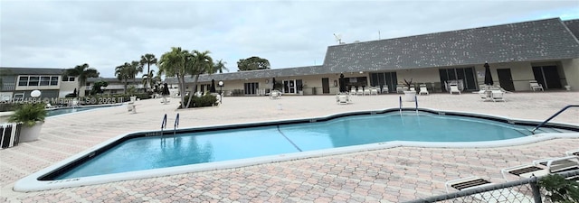 view of swimming pool with a patio