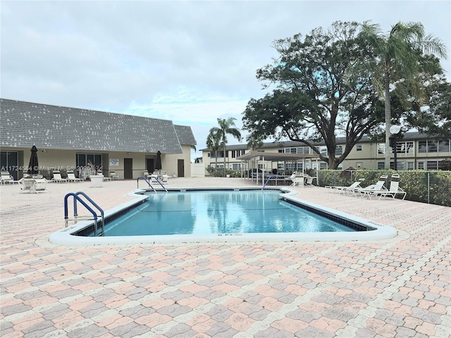 view of swimming pool with a patio area