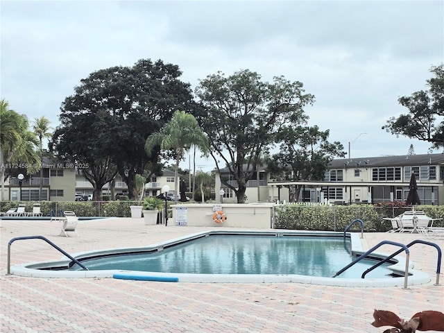 view of swimming pool with a patio