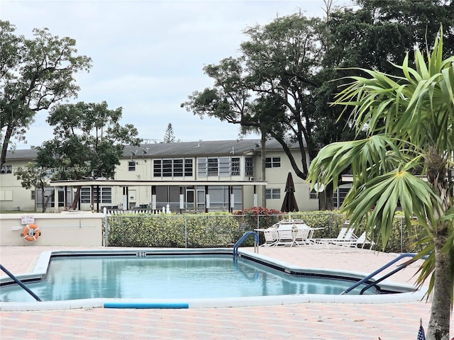 view of swimming pool with a patio area