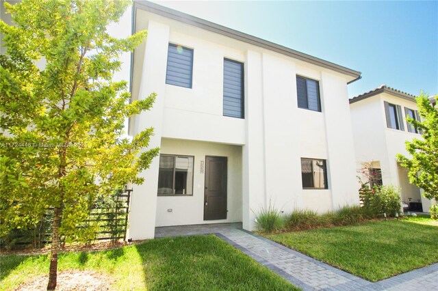 view of home's exterior with a lawn