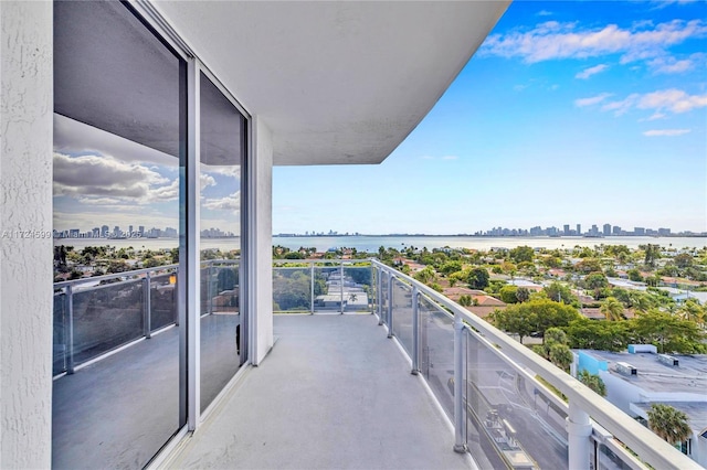 balcony featuring a water view