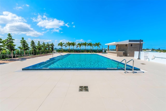 community pool featuring a patio area