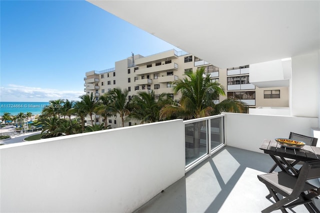 balcony featuring a water view