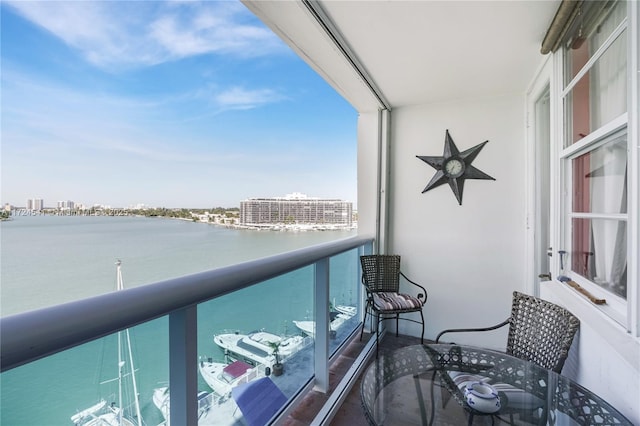 balcony featuring a water view