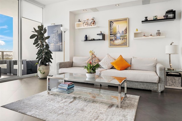 tiled living room with a wall of windows