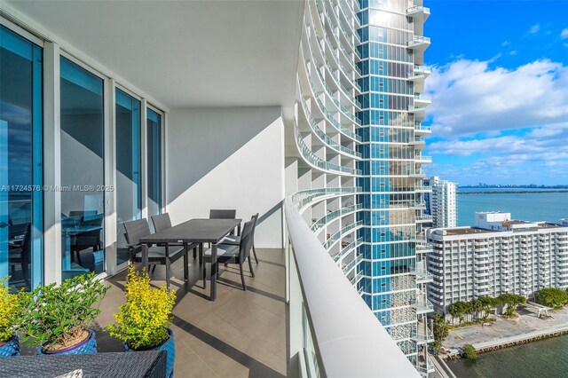 balcony featuring a water view