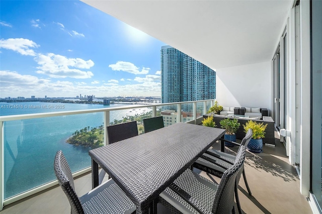 balcony featuring a water view