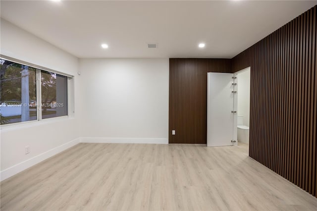 unfurnished room featuring light wood-type flooring