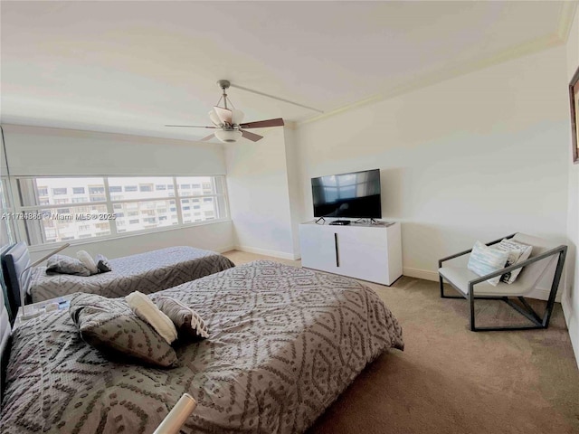 bedroom featuring light carpet and ceiling fan