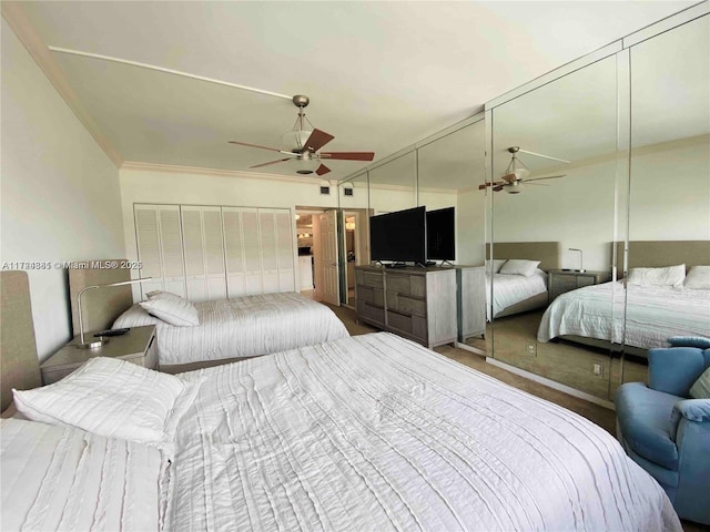 bedroom featuring ceiling fan and crown molding