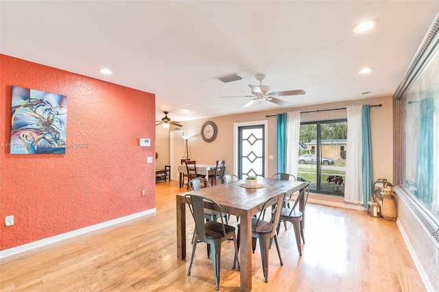 dining area featuring ceiling fan and light hardwood / wood-style flooring