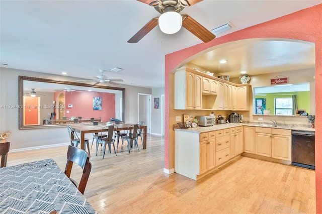 kitchen with dishwasher, light brown cabinetry, and light wood-type flooring