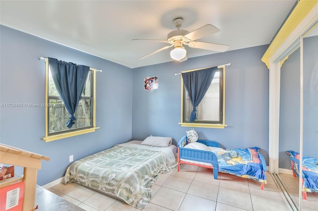 bedroom featuring ceiling fan and light tile patterned floors