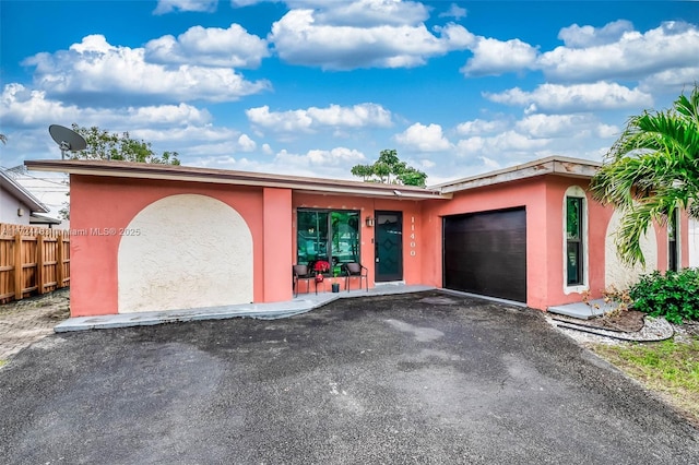 ranch-style house featuring a garage