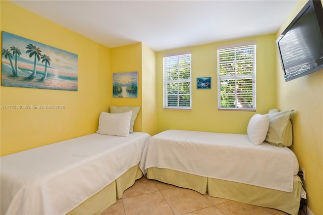 bedroom with light tile patterned floors