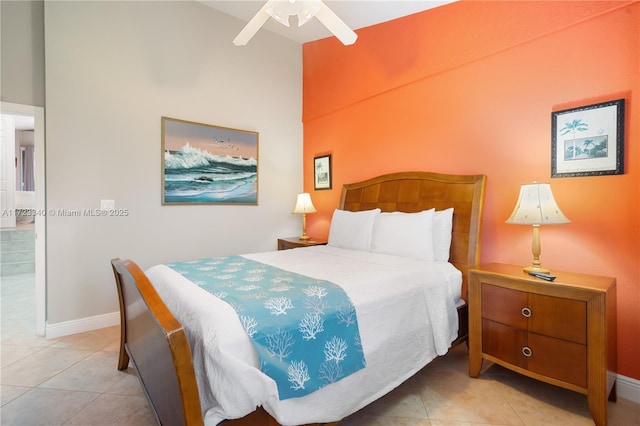 bedroom with ceiling fan and light tile patterned floors