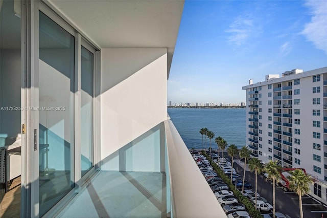 balcony featuring a water view