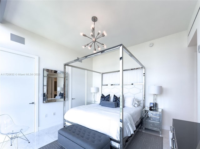 bedroom featuring a notable chandelier