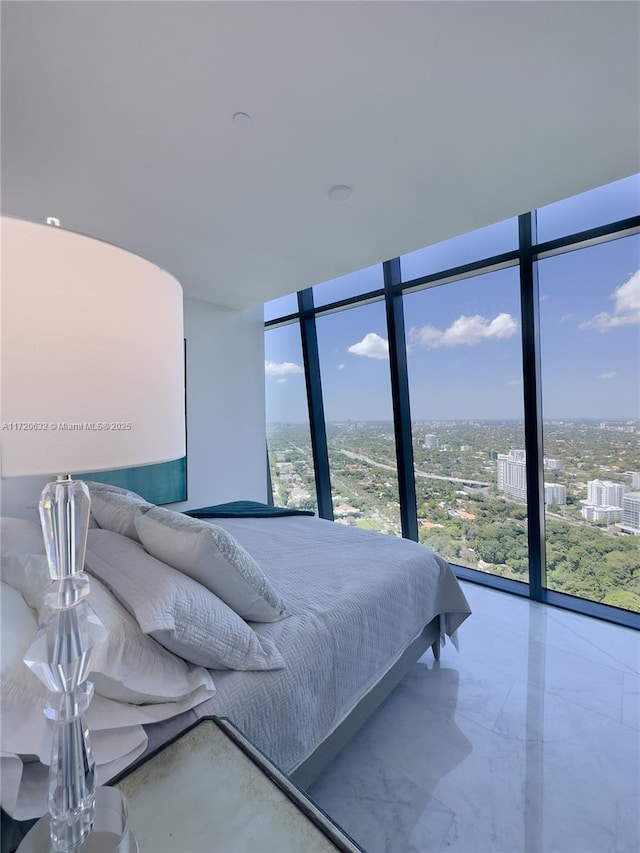 bedroom featuring expansive windows