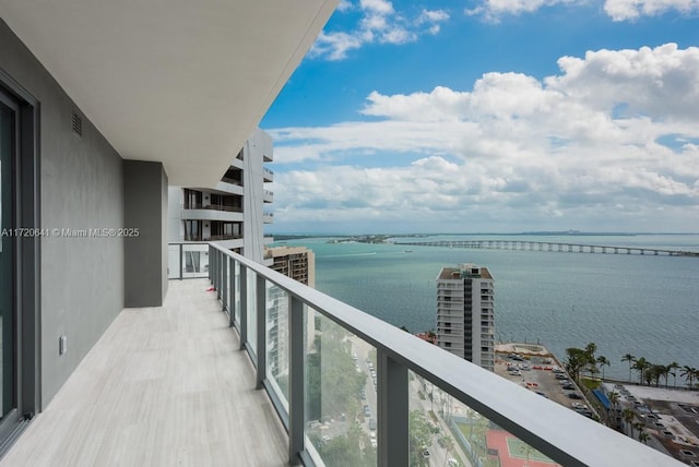 balcony featuring a water view