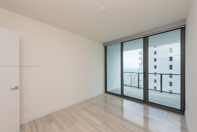 spare room featuring expansive windows