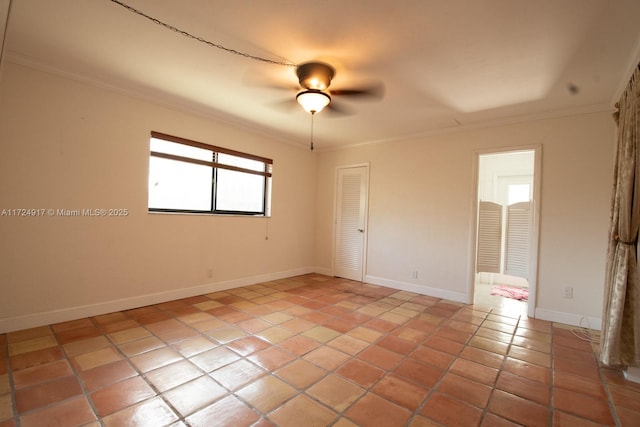 tiled empty room with ceiling fan and crown molding