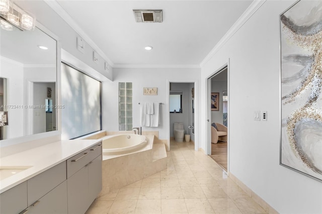 bathroom featuring toilet, tiled tub, vanity, and ornamental molding