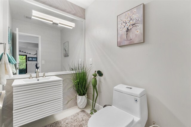 bathroom with crown molding and vanity