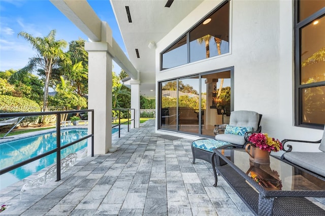 view of pool featuring a patio