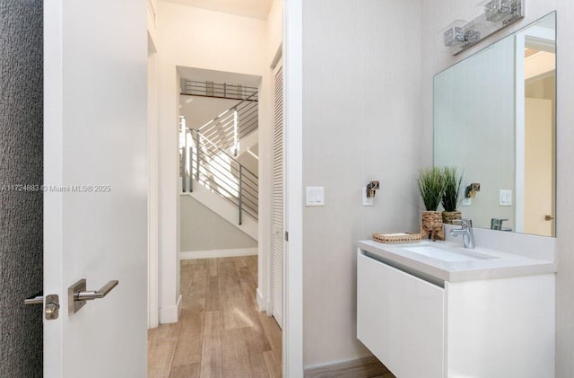 bathroom featuring wood-type flooring and vanity