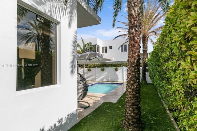 view of swimming pool featuring a patio area