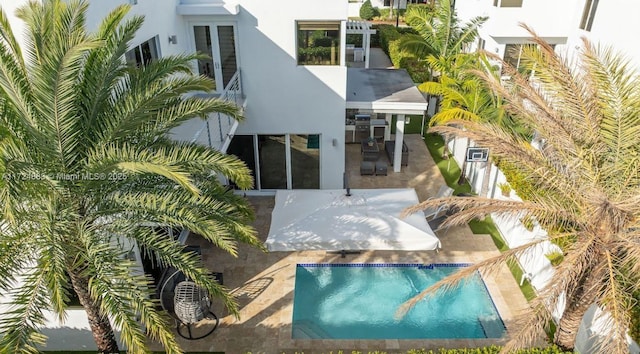 rear view of property featuring a patio