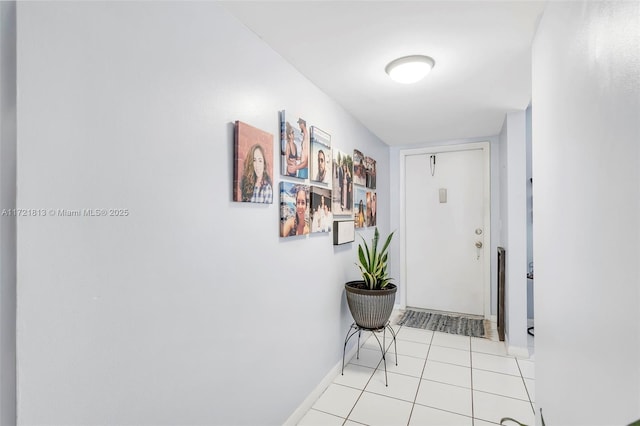 corridor featuring light tile patterned floors