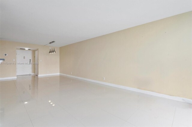 spare room featuring tile patterned floors