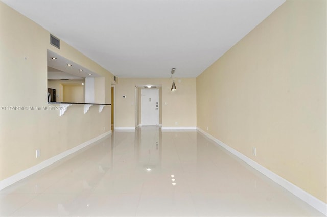 empty room featuring tile patterned flooring