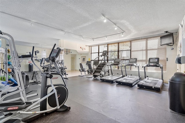 workout area featuring a textured ceiling