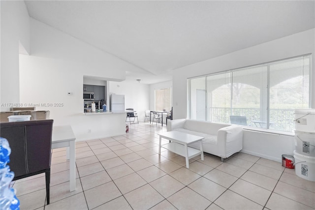 tiled living room with lofted ceiling